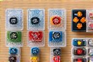 Various board game accessories like dice, card sleeves, and token trays